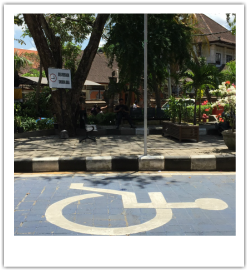 Photograph of a handicapped parking space.
