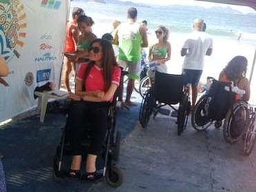 Photograph of people in wheelchairs on a beach in Rio de Janeiro